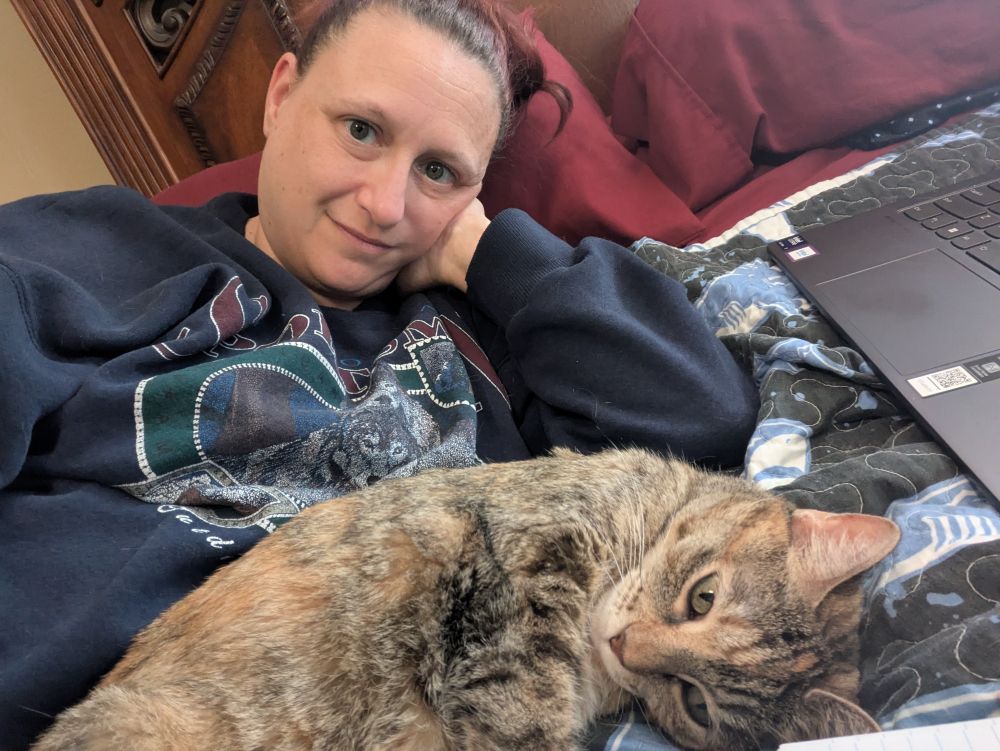 Me, resting after surgery. My cat is also resting, though that is her normal state.