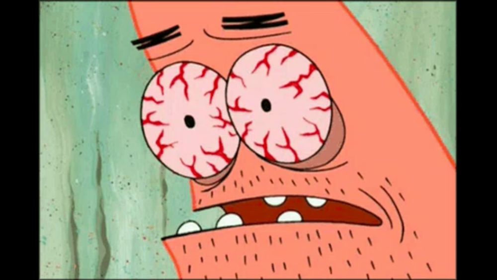 a close up of patrick star 's face with his eyes closed