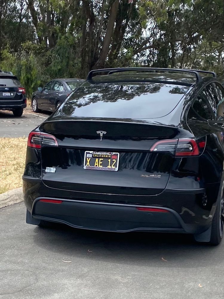 Tesla with X AE 12 plate. 