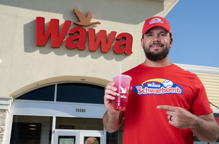 klye schwarber outside a wawa pointing at a delicious iced beverage