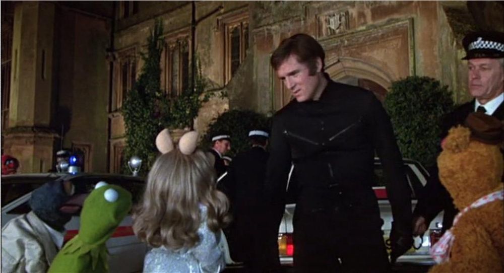 Nicky Holiday (Charles Grodin) with (Left to right) Gonzo, Kermit, Miss Piggy, and Fozzie Bear. 