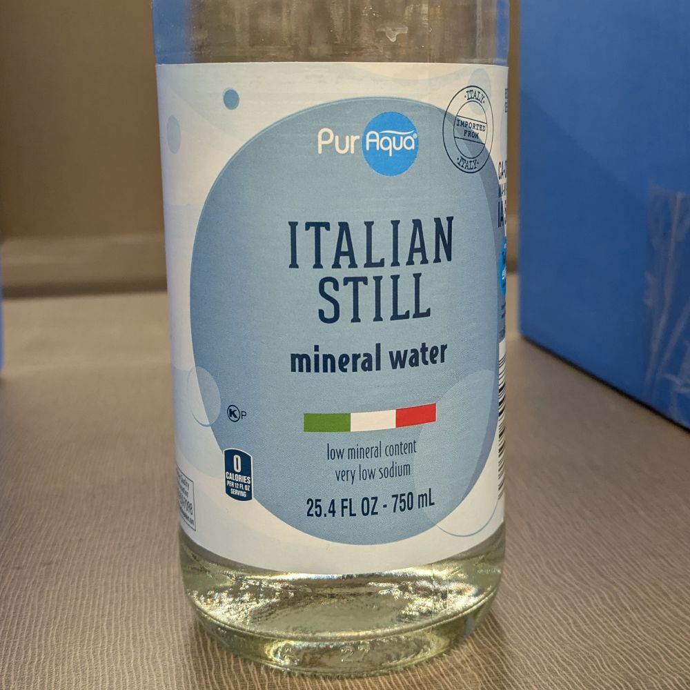 A bottle of water with an "ITALIAN STILL" label.