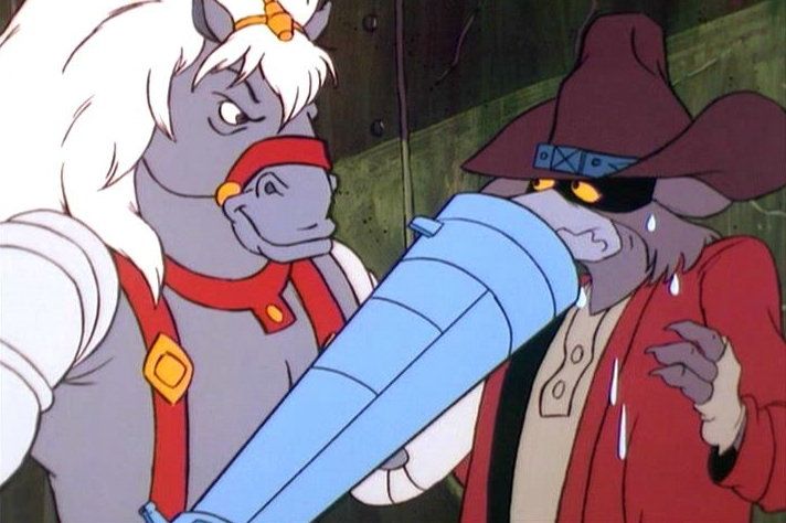 That big cyborg hoss menaces a space raccoon or possibly Orko's dead-beat dad.