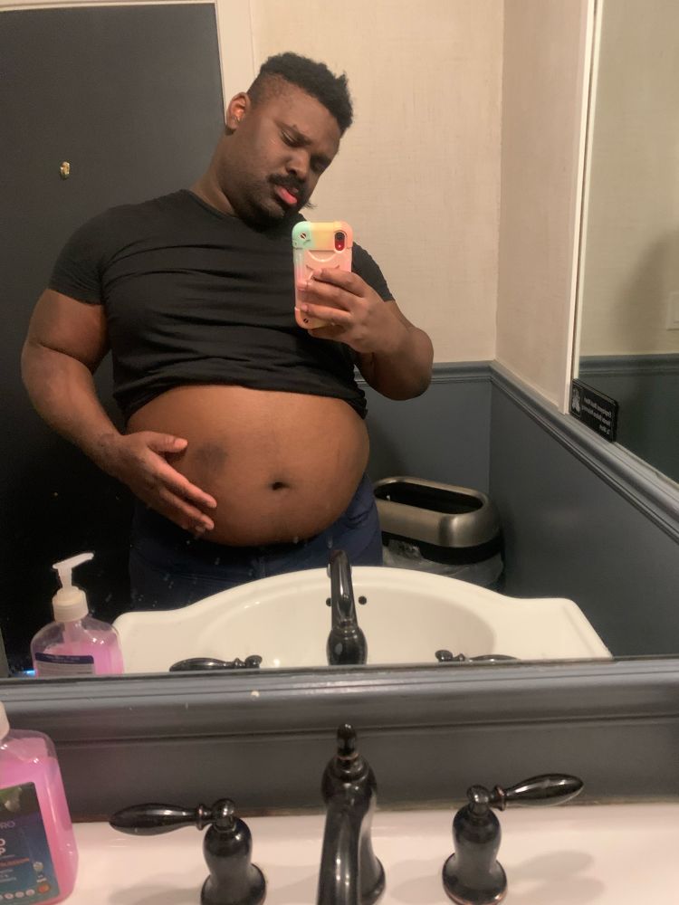 Me, full of food, amazed at my own fat belly. 