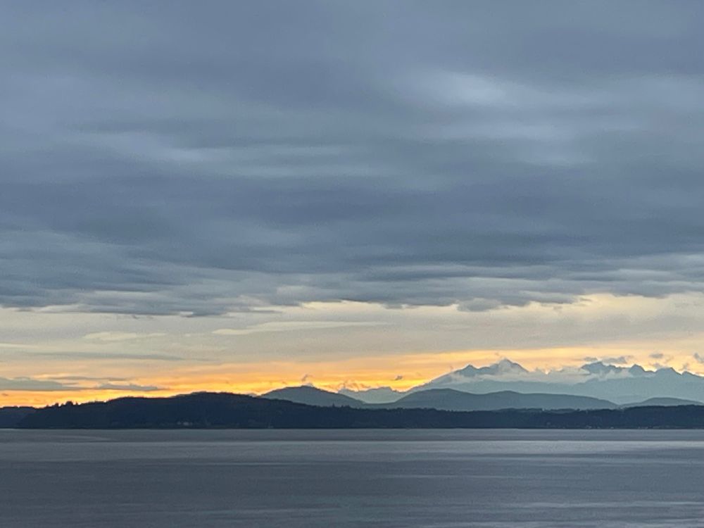 Sun setting over Olympic Peninsula and Elliot Bay