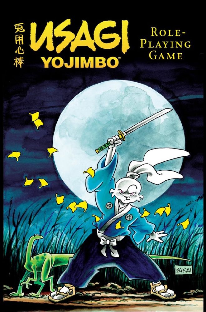 Portada del juego de rol Usagi Yojimbo.
Un conejo samurái de largas orejas alza su katana, rodeado de hojas de ginko llevadas por el aire. A la izquierda un lagarto le mira curioso. 
Tras ellos se eleva la luna llena ocupando casi toda la portada. 
Predomina el color azul del cuello nocturno y la ropa del samurái