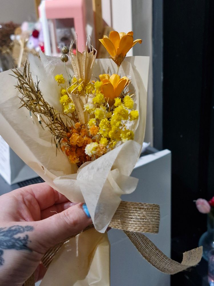 A bouquet of yellow and orange flowers 