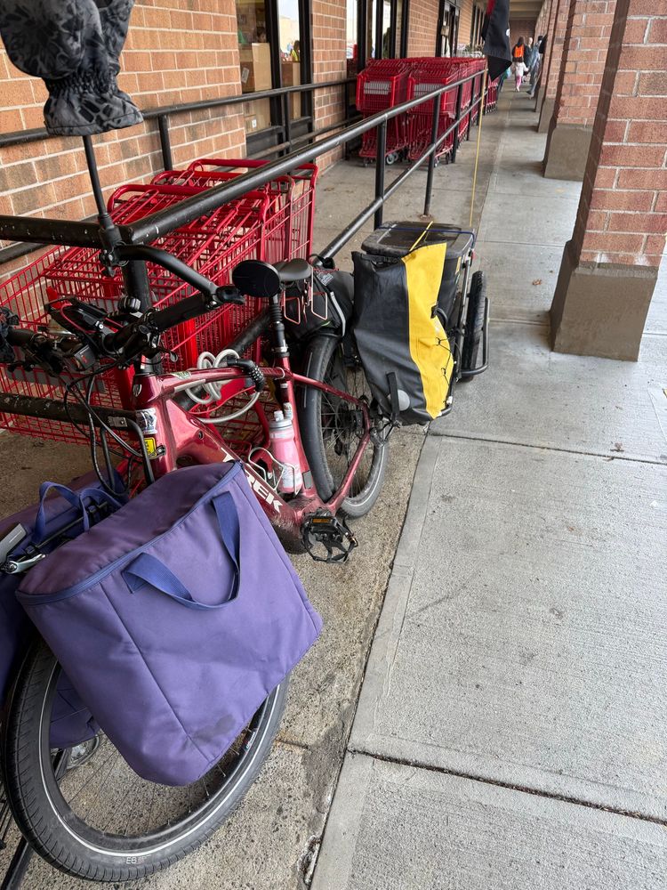 E-bike with front and back panniers plus bike trailer 