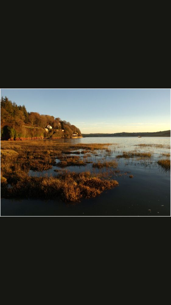 Landscape photograph showing the estuary at Laugharne, Carmarthenshire.