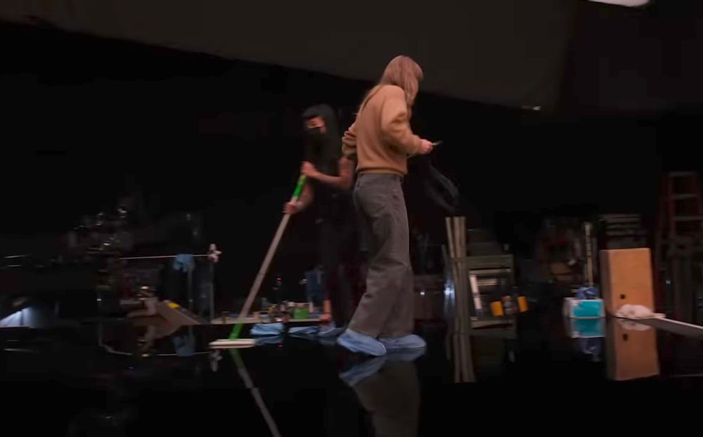 Taylor Swift from the behind the scenes YouTube video of the karma (feat. Ice spice) music video. Screenshot from when she says "sooooo excited. This is the main event" at 2:00 timestamp