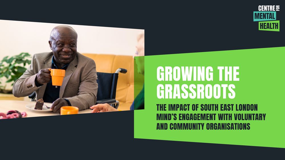 An older Black man is sitting in a wheelchair in a relaxed space having a cup of tea and a slice of cake. He is smiling and in conversation with another older person. Text: Growing the grassroots: The impact of South East London Mind's engagement with voluntary and community organisations