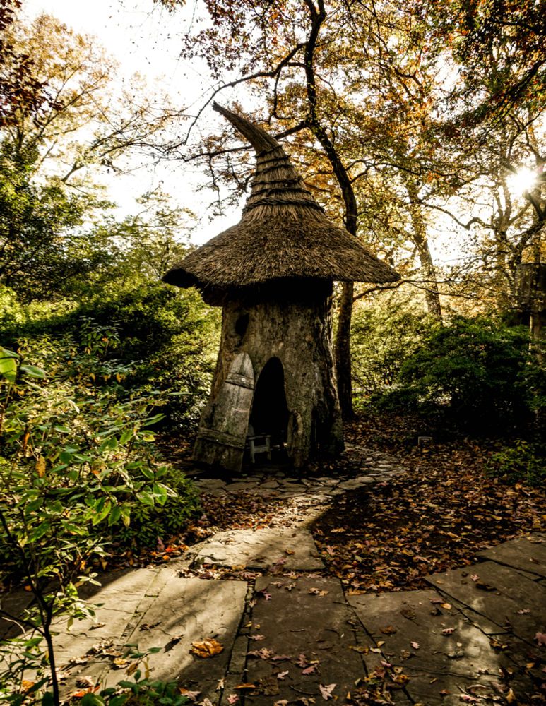 Garden whimsy at Winterthur museum and garden. Fantasy wizardry hut with a peaked hat roof and aged look. 