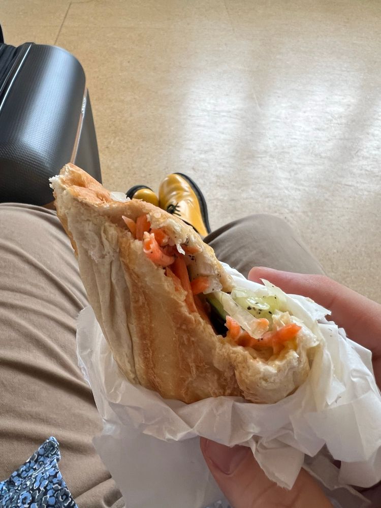 Andrew holding an unwrapped bahnmi