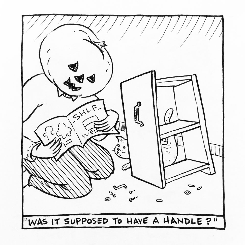 Pumpkinhead kneels next to a small lop-sided bookshelf with a drawer handle on the side and what appears to be extra unused parts on the floor. A cat peers around  the shelf and looks up at Pumpkinhead who is re-consulting the instructions. The caption reads “was it supposed to have a handle?”