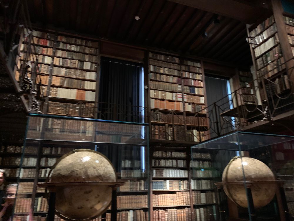 The entrance of the original reading room, where these two old globes sat.