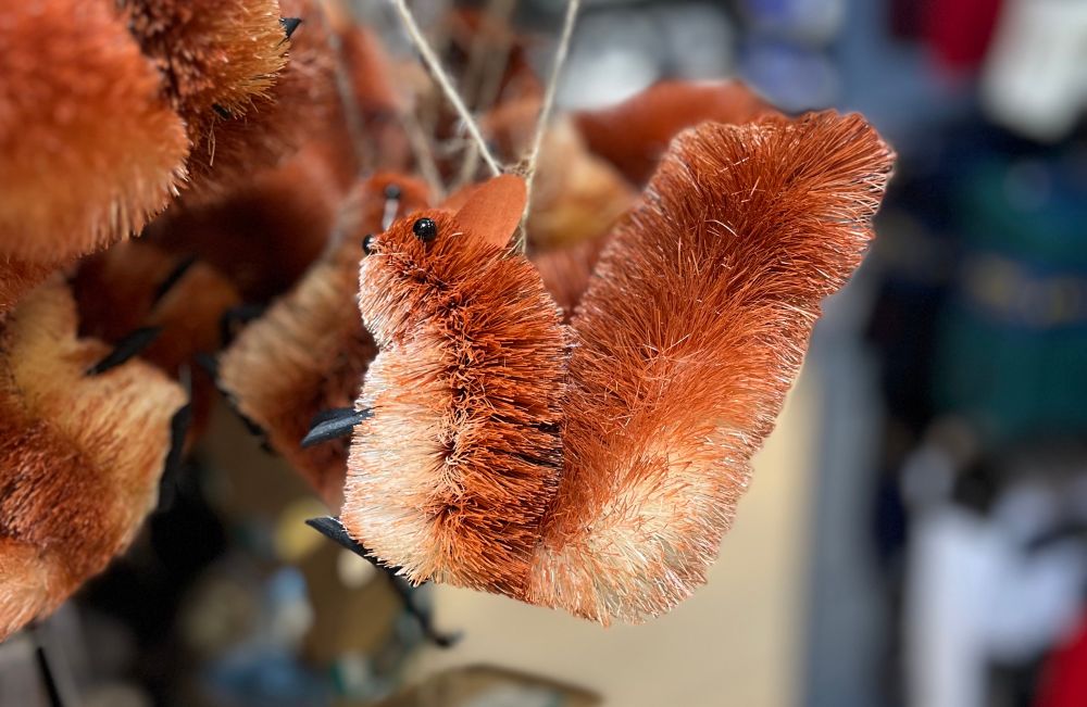 A squirrel ornament neither made of fabric nor plastic nor metal.
