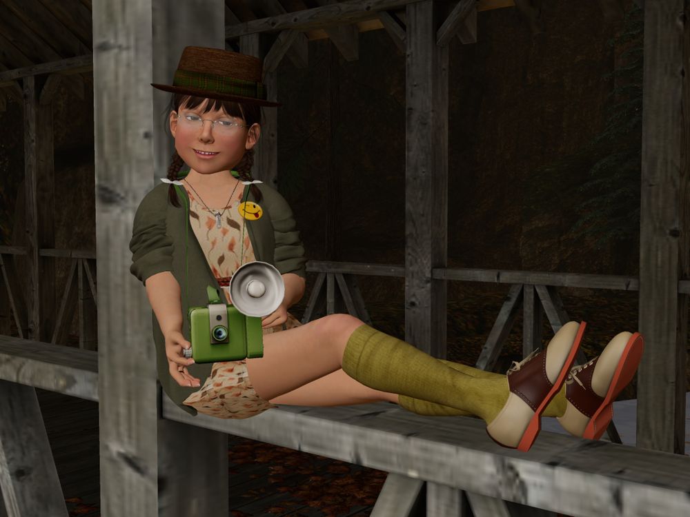 a screen capture taken in Second Life. An avatar sitting on the railing of a covered bridge, pointing a camera at the viewer of the image, She is wearing autumn browns and greens
