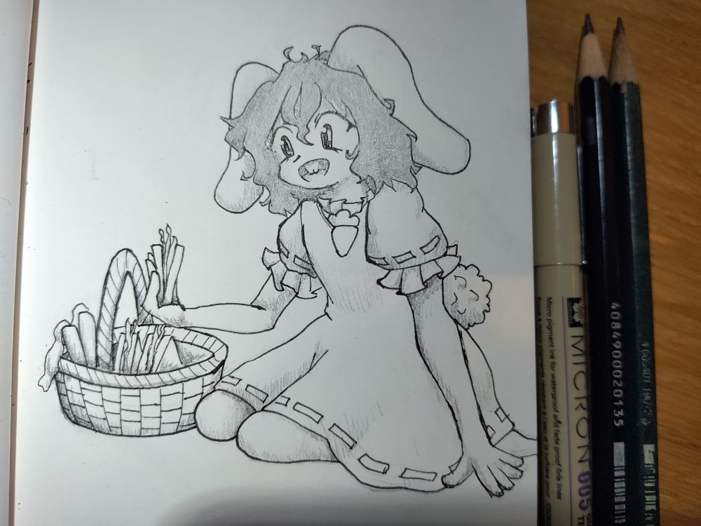 Tewi holding a sandwich next to a picnic basket.