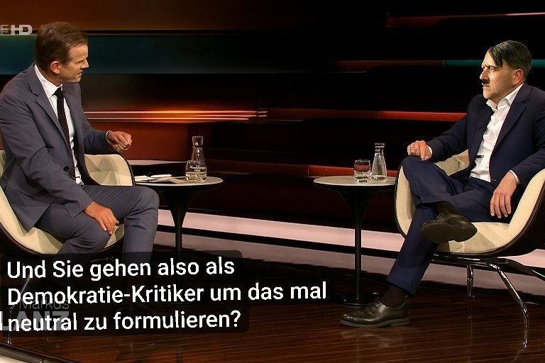 Markus Lanz sitzt mit Hitler im Studio dazu der Satz 'Und Sie gehen also als Demokratie-Kritiker um das mal neutral zu formulieren?"