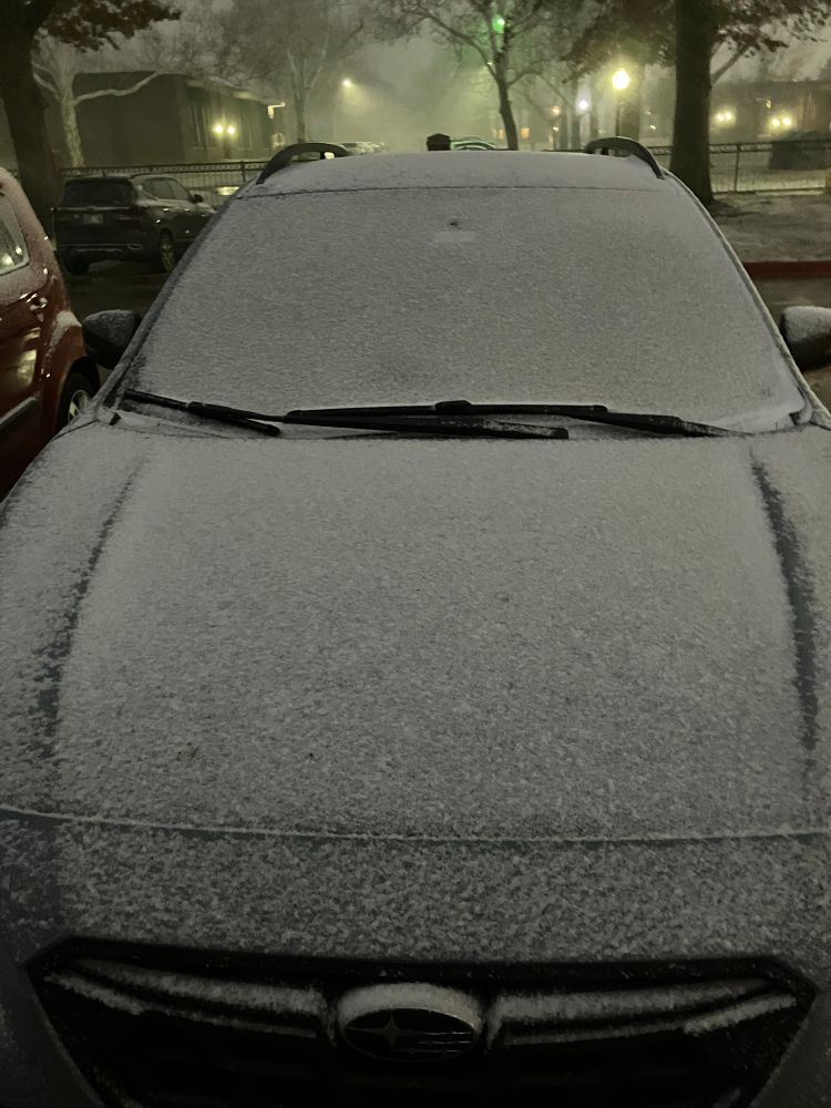 Dusting of snow on car