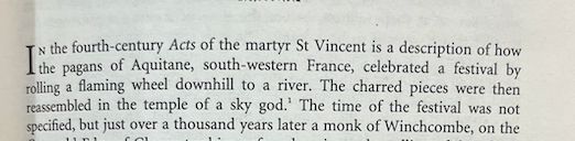 Text from Ronald Hutton's Stations of the Sun, describing 4th-century account of pagans in SW France rolling a burning wheel down a hill to river.