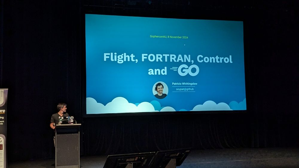 Patricio in front of his title slide