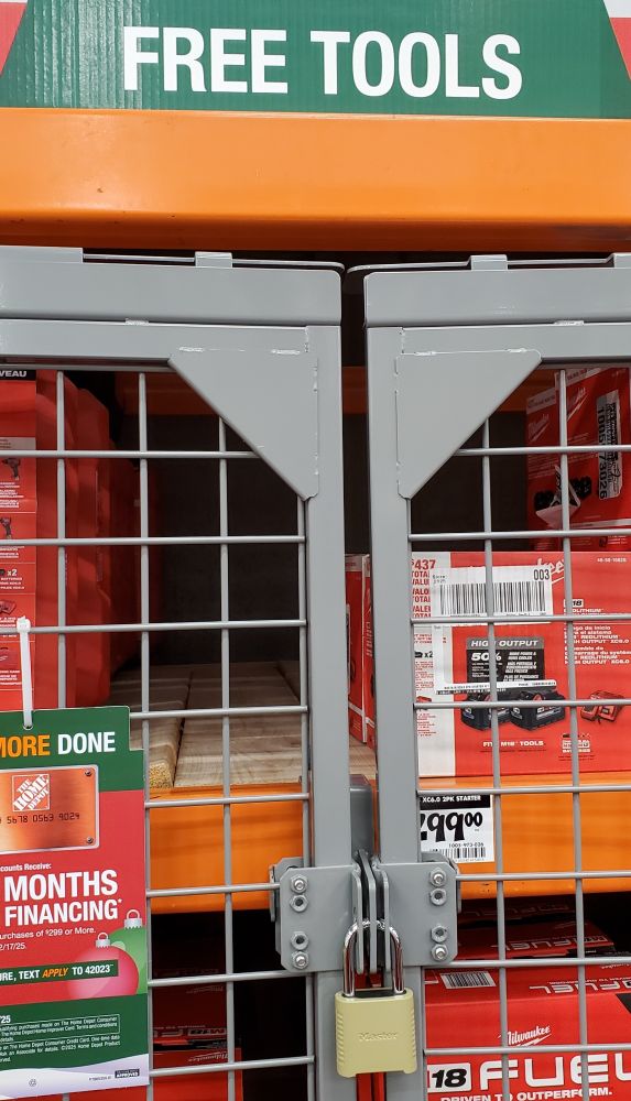 Tools at Home Depot locked up in case under sign that says ""free"