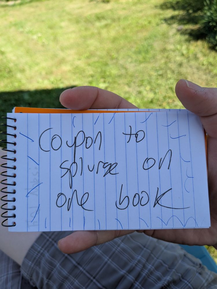 Page of my memo pad but this one says "coupon to splurge on one book"