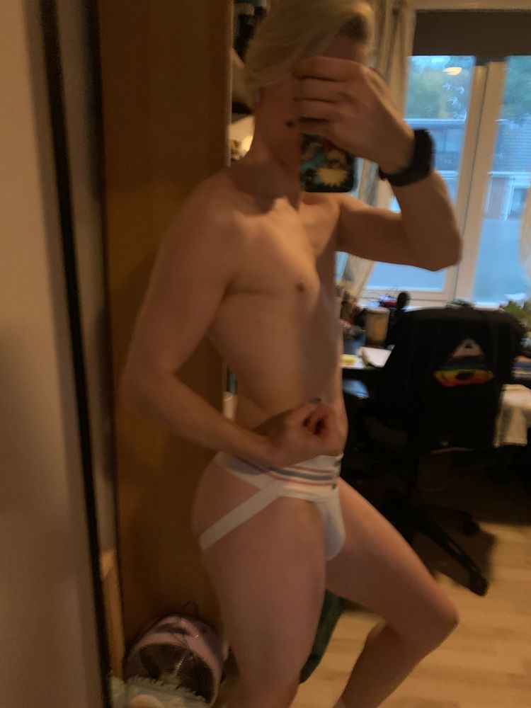 Jockstrap wearing twink flexing
