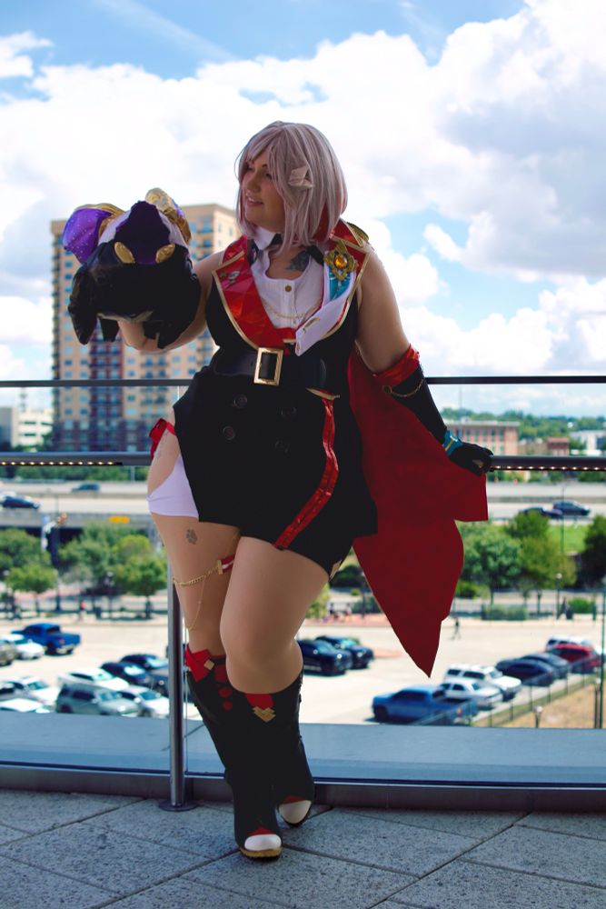 Cosplay of Topaz and Numby (as a puppet) from Honkai: Star Rail