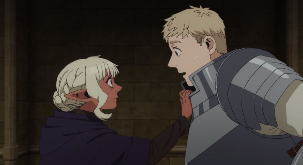 Thistle (a short, medium skinned blond elf) grabs Laios (a tall blond white man in armor) by his breastplate and pulls him closer