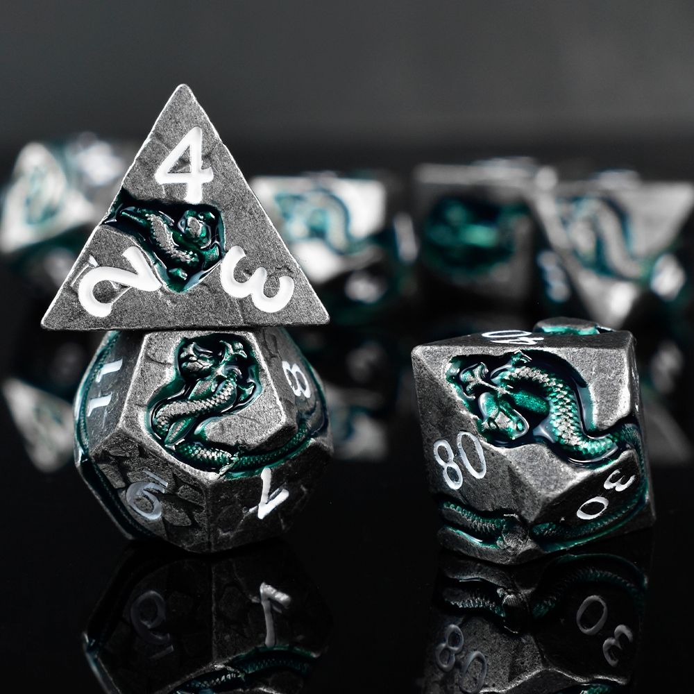 Dear esteemed adventurers! We are honored to introduce our latest uniquely designed dice series — the Serpent's Dagger Dice!

A green serpent coiled around a deadly dagger spirals across your dice! With bold aesthetics, perfect weight, and fair rolls… these are metal dice that embody both form and function.

Take advantage of the exclusive pre‑order discount during the pre‑sale event!