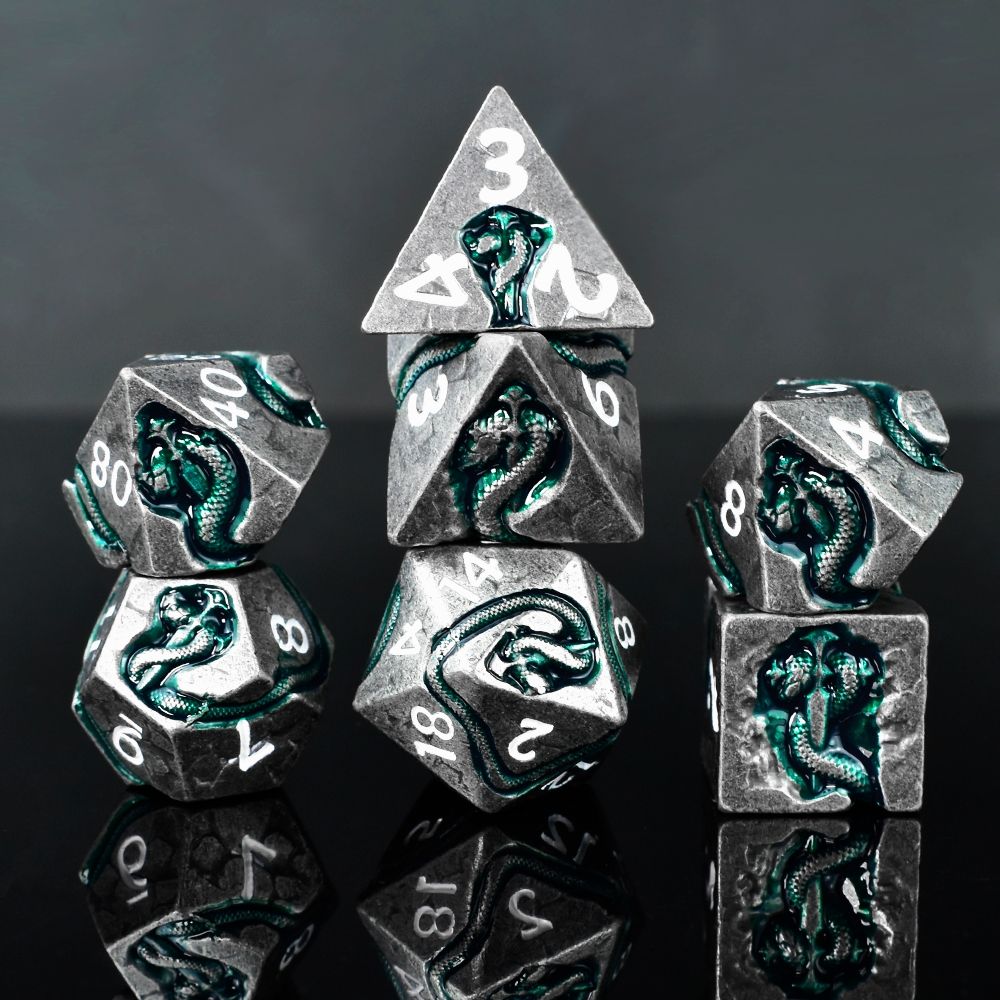 Dear esteemed adventurers! We are honored to introduce our latest uniquely designed dice series — the Serpent's Dagger Dice!

A green serpent coiled around a deadly dagger spirals across your dice! With bold aesthetics, perfect weight, and fair rolls… these are metal dice that embody both form and function.

Take advantage of the exclusive pre‑order discount during the pre‑sale event!