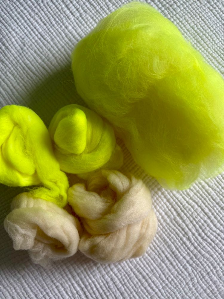 Finished mini batt and 4 nests of fiber ready to be blended.