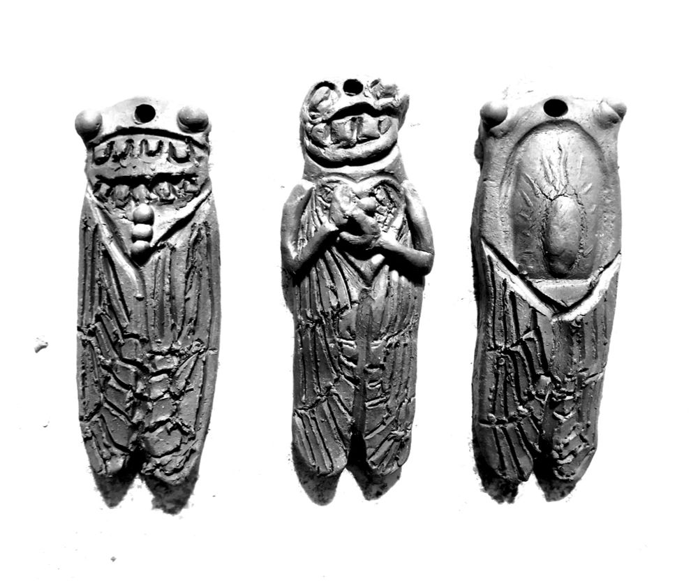 3 small Cicada ornaments with stamped eyes and weird faces