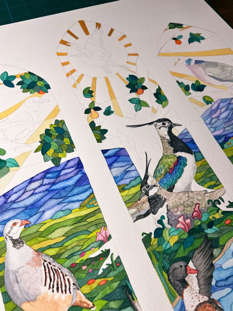 Closeup of a work-in-progress watercolor piece inspired by stained glass and featuring Irish birds 