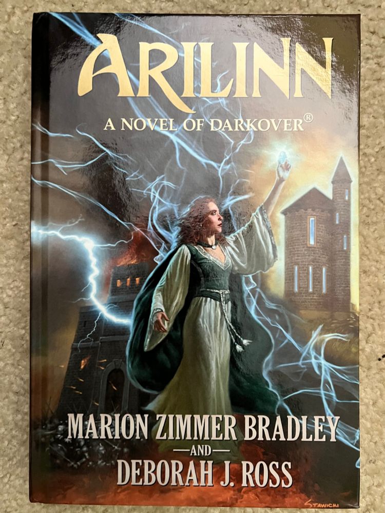 A women stands outdoors with a castle in the background. She looks up at a glowing blue crystal held aloft in her hand as she uses psychic powers.  Lightning and energy crackles in the air behind her.