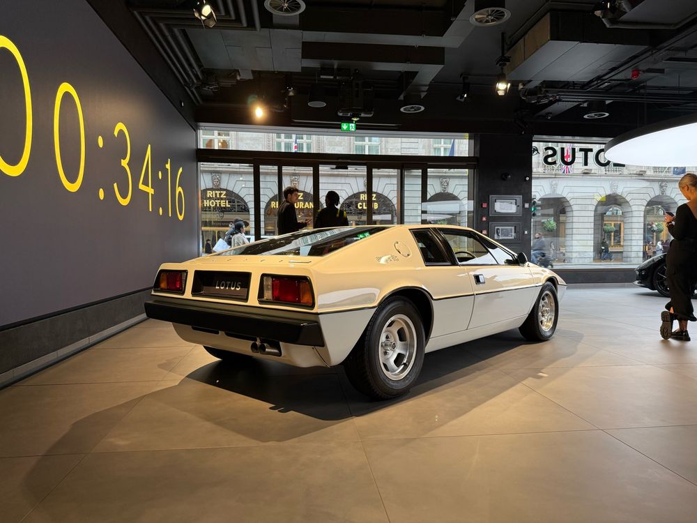 A rear three quarter view of a white Lotus Esprit, in the Lotus Showroom, London UK. 