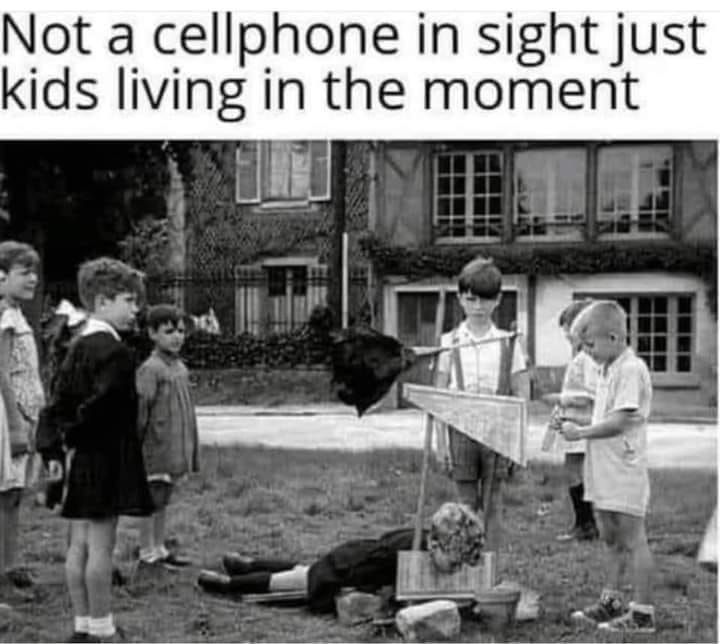 A picture of some kids from the 1950s (or thereabouts) playing with a very realistic-looking guillotine, with one kid lying with his head in it and the blade in ready position. It bears the caption: Not a cellphone in sight just kids living in the moment.