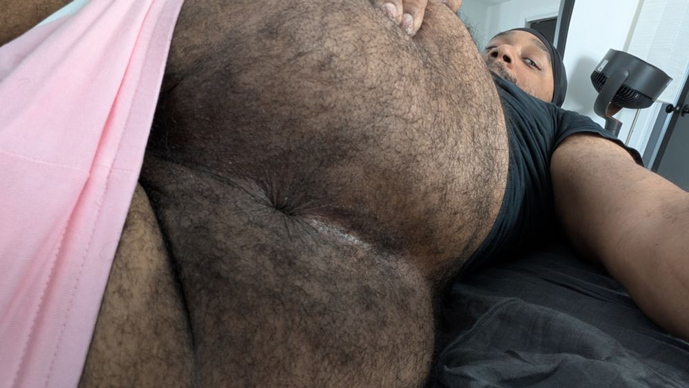 Laying on my side with my shorts down below my butt, one hand spreading my hairy cheeks to expose my hole for you to bury your face in