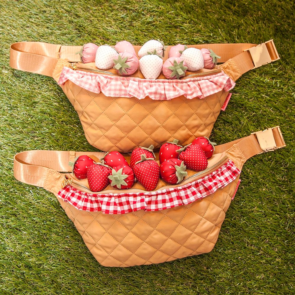 Fanny packs that look like baskets filled with strawberries