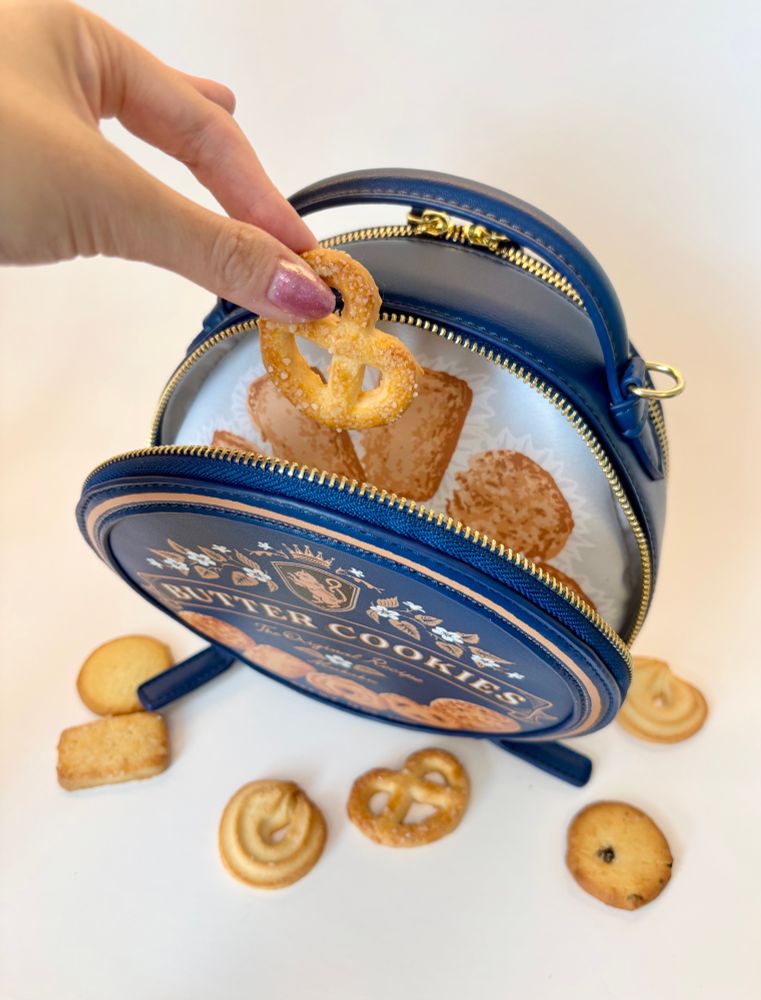 Open cookie tin purse showing the inner lining which looks like an open tin of cookies
