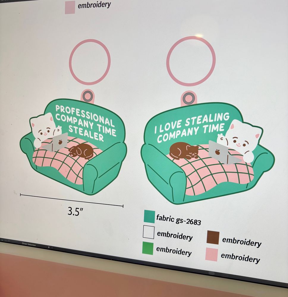 Photo of my computer screen showing my new keychain design that reads “professional company time stealer” and “I love stealing company time” on the other side. The design is of a cat on their laptop relaxing on their couch