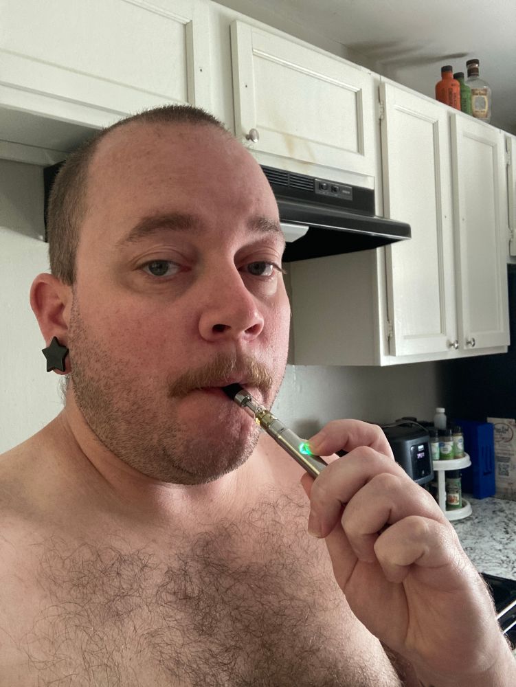 Puffing on my vape. 