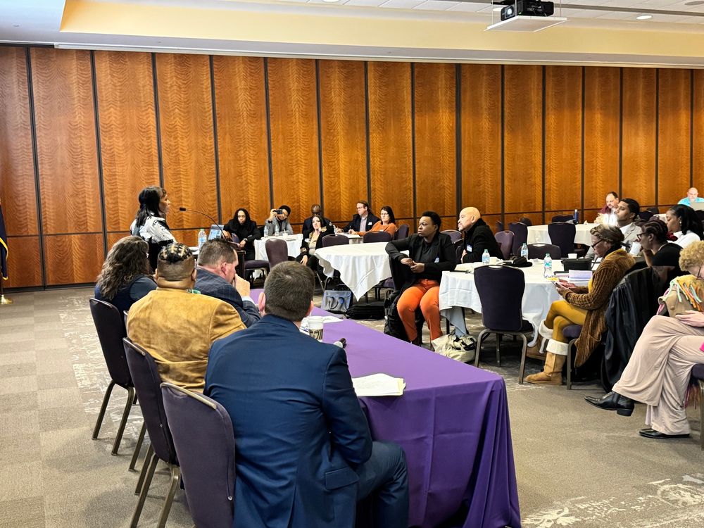 The panel and crowd at the Housing Jubilee.