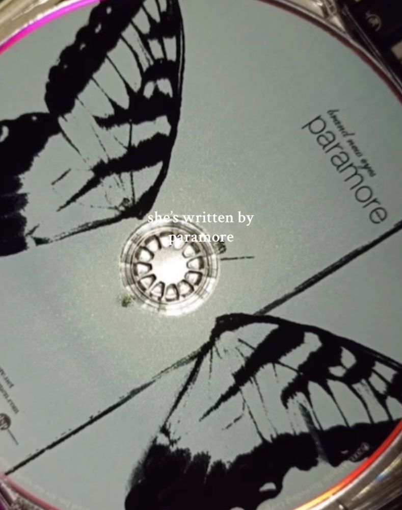 Paramore’s album Brand New Eyes with the caption “she’s written by paramore”