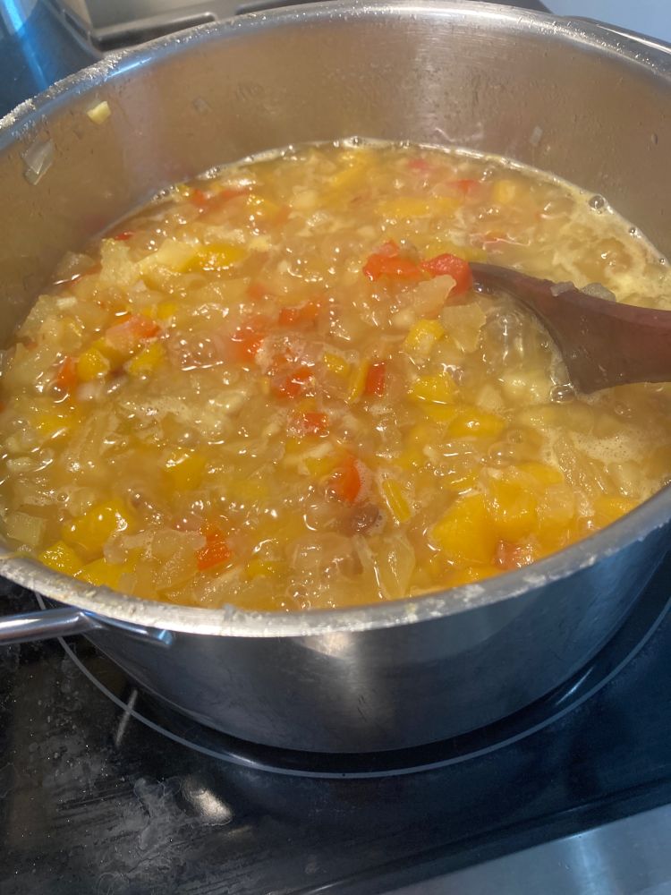 Pot full of mango chutney cooking on the stove. The smell was incredible!  Yum!