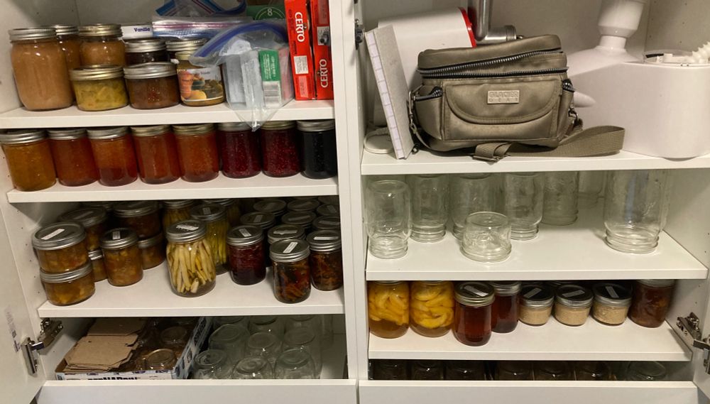This is my rearranged canning cupboard. Peaches and Dijon mustard are joined by apple cider cinnamon jelly and rhubarb orange marmalade on the lower left shelf. Slowly getting there! 
