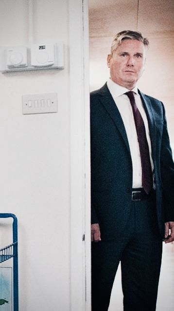 Keir Starmer standing menacingly in a doorway