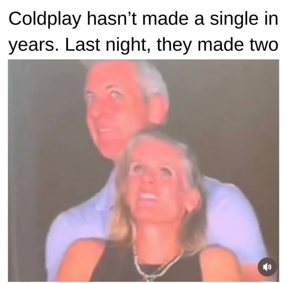 Still of man and woman caught in an embrace on the jumbotron. The text above the image says “Coldplay hasn’t made a single in years. Last night they made two”